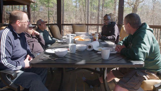 <p>courtesy netflix</p> The dads talk about their shared experiences over a morning breakfast.