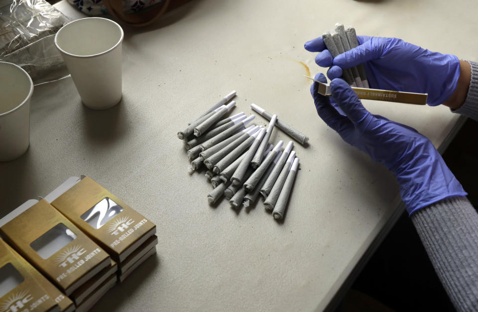 A worker at the Hollingsworth Cannabis Company near Shelton, Wash., packages pre-rolled marijuana joints. (Photo: Ted S. Warren/AP)