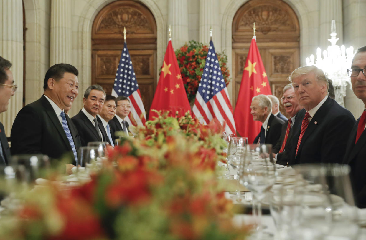 In this Dec. 1, 2018, photo, President Donald Trump, second from right, meets with China's President Xi Jinping, second from left, during their bilateral meeting at the G20 Summit, in Buenos Aires, Argentina. China promised Wednesday, Dec. 5, 2018, to carry out a tariff cease-fire with Washington but gave no details that might help dispel confusion about what Presidents Xi and Trump agreed to in Argentina.(AP Photo/Pablo Martinez Monsivais, File)