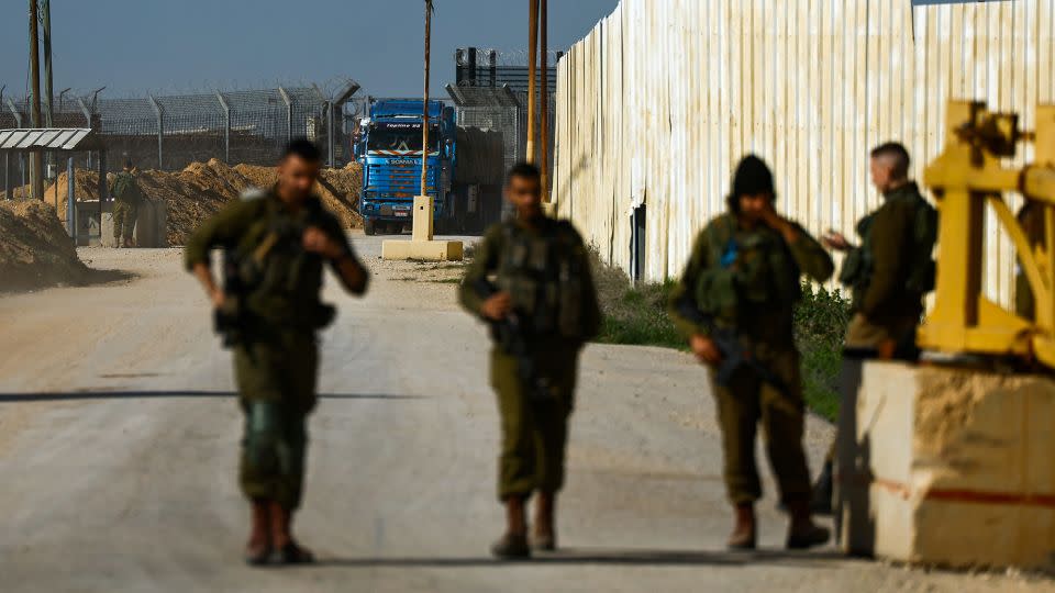 An aid truck enters from Egypt en route to Gaza as seen from the Kerem Shalom crossing in Israel on December 22, 2023. - Clodagh Kilcoyne/Reuters