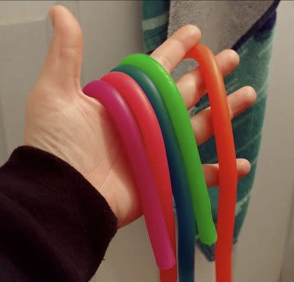 A set of five stretchy fidget noodles