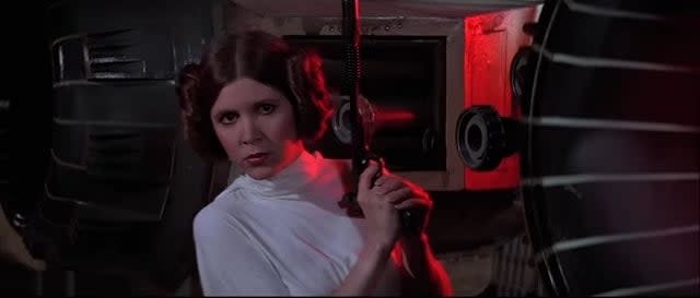 Princess Leia wielding a blaster in "Star Wars: Episode IV - A New Hope"