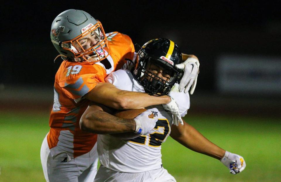 Isaiah Hernandez is tackled by CJ Bell. Atascadero won in a football game with San Luis Obispo 28-24 Sep., 23, 2022.