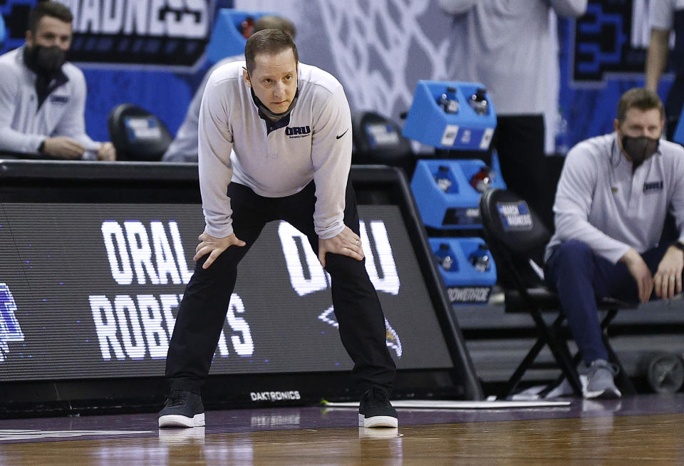 INDIANAPOLIS, INDIANA - MARCH 21: Head coach Paul Mills of the Oral Roberts Golden Eagles looks on in the second half against the Florida Gators in the second round game of the 2021 NCAA Men's Basketball Tournament at Indiana Farmers Coliseum on March 21, 2021 in Indianapolis, Indiana. (Photo by Maddie Meyer/Getty Images)