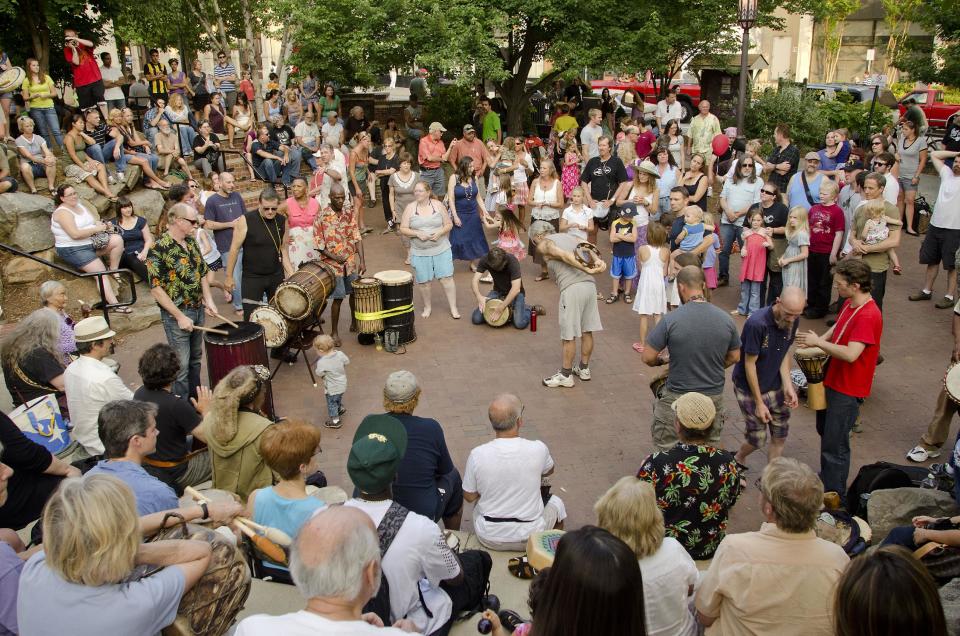 This June 2011 photo courtesy of Explore Asheville shows a drum circle at Pritchard Park in Asheville, N.C. This gem of a city tucked in the Blue Ridge foothills of western North Carolina attracts artists, musicians, foodies, outdoor enthusiasts and a fair share of modern-day hippies, all lured by the beautiful setting and open-minded vibe. (AP Photo/Explore Asheville, Ian Curcio)