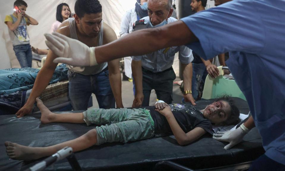 Palestinian medics transport an injured girl to the hospital following a reported Israeli strike in Rafah in the southern Gaza Strip, (AFP via Getty Images)
