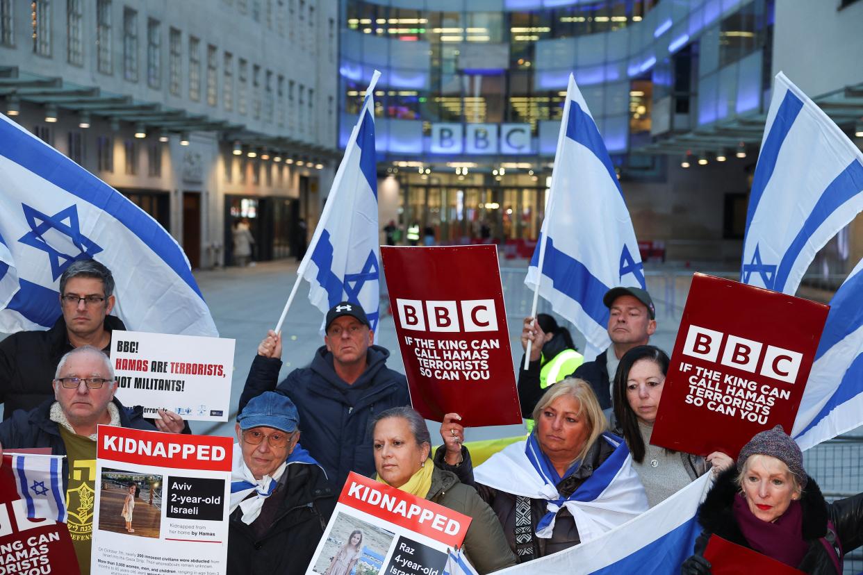 Protestors gather with placards outside the BBC Broadcasting House (Reuters)