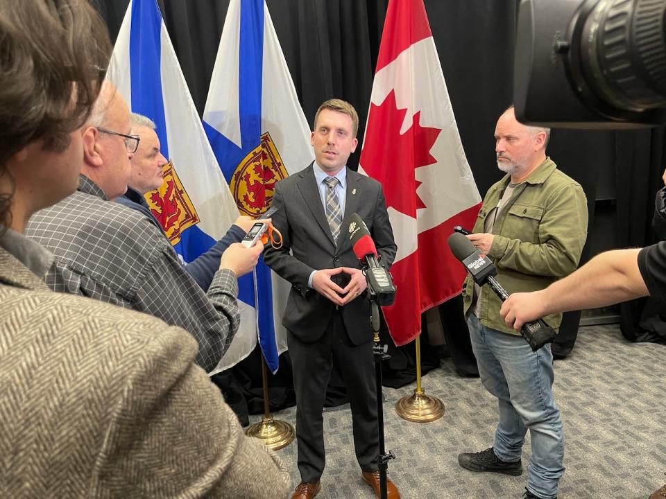 Liberal MLA Braedon Clark speaks to reporters on Monday.