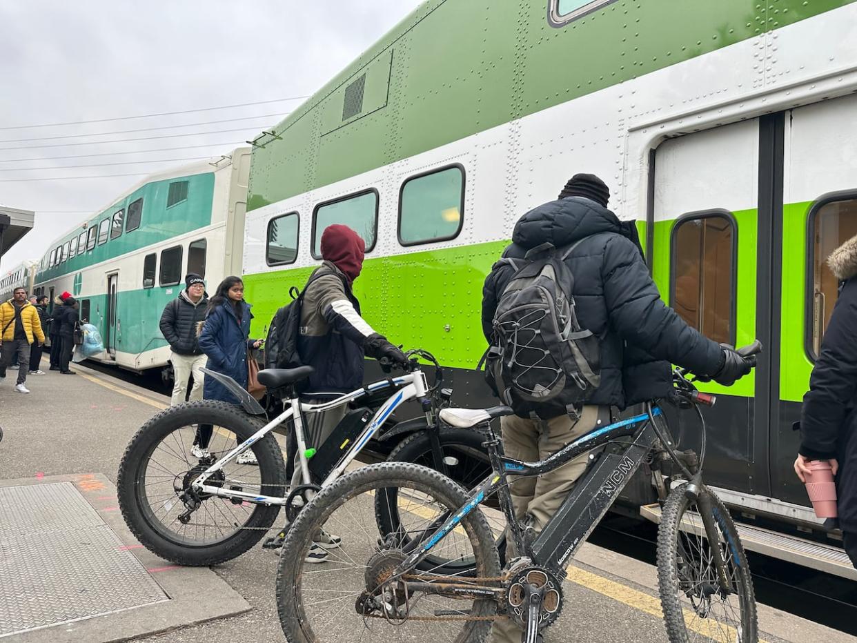 Metrolinx says it is not changing its e-bike policy allowing e-bikes on GO trains and buses, but that it's reviewing the policy in light of the e-bike fire on a TTC subway train last week. (Saloni Bhugra/CBC - image credit)