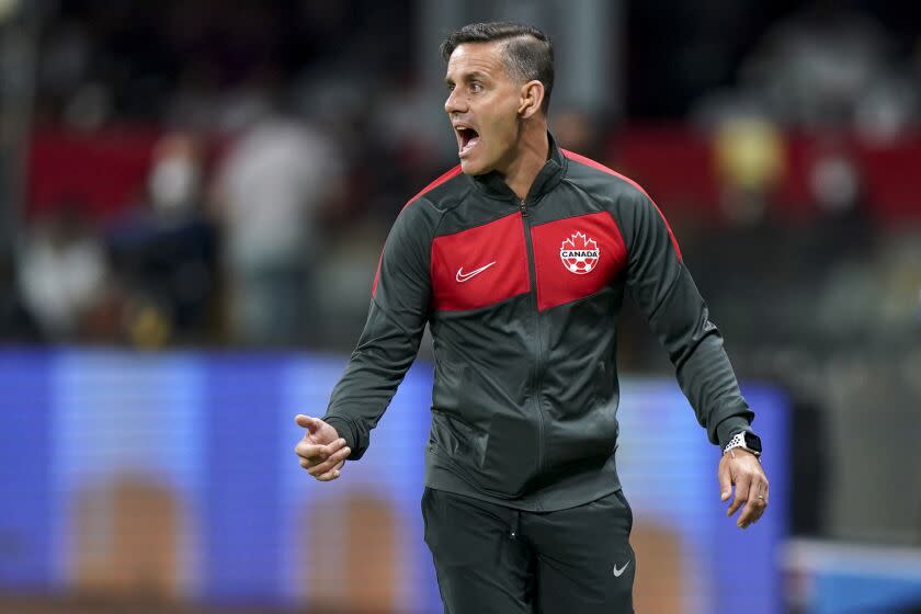 FILE- Canada's coach John Herdman reacts during a qualifying soccer match against Mexico for the FIFA World Cup Qatar 2022 in Mexico City, on Oct. 7, 2021. (AP Photo/Fernando Llano, File)