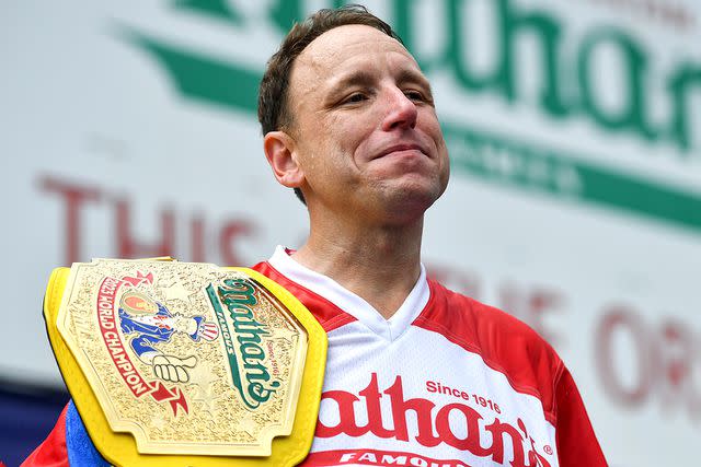 <p>Erik Pendzich/Shutterstock</p> Joey Chestnut after winning the Nathan's Hot Dog Eating Contest in 2023