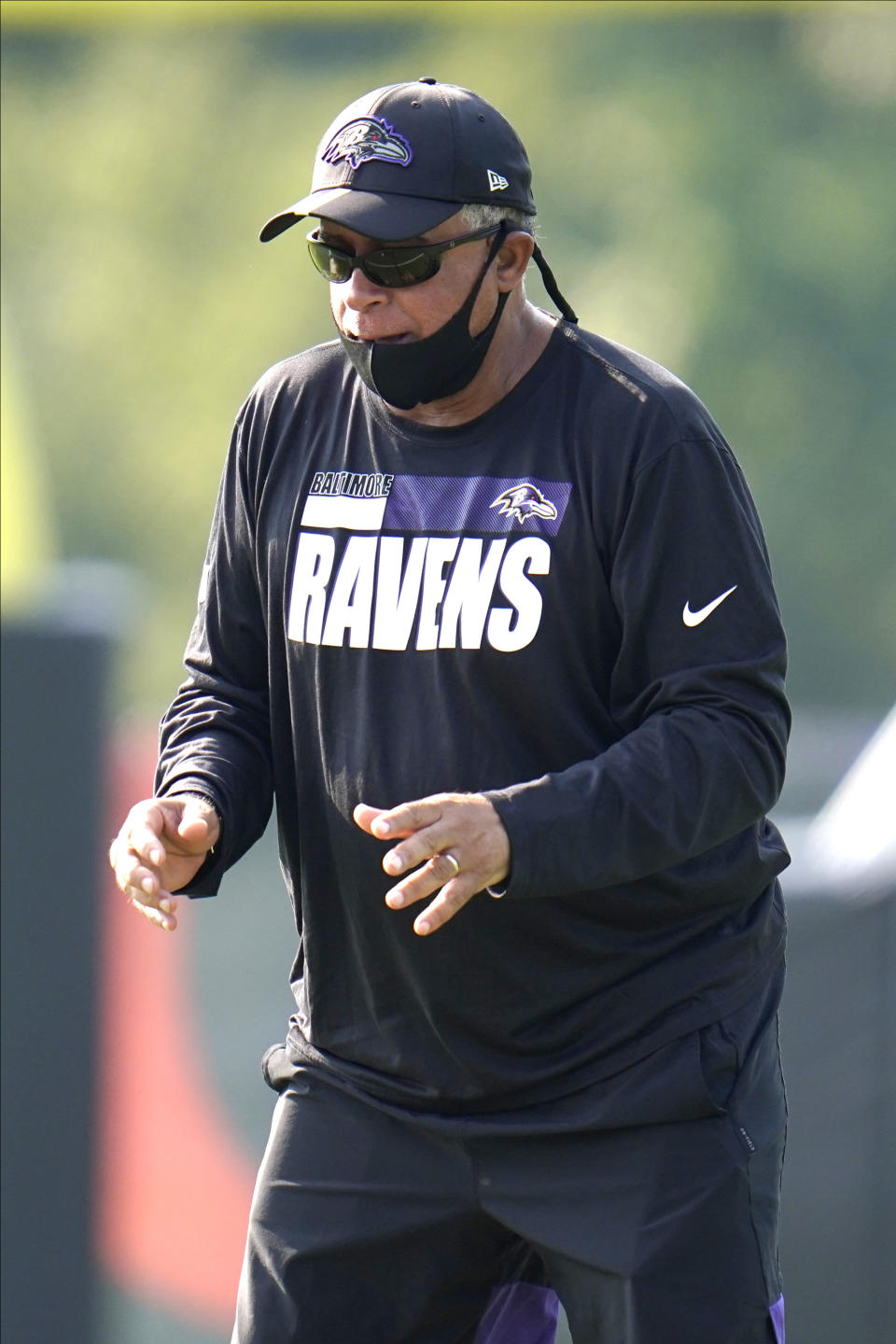 FILE - Baltimore Ravens assistant head coach David Culley works with wide receivers during an NFL football training camp practice in Owings Mills, Md., in this Tuesday, Aug. 25, 2020, file photo. David Culley has been hired as the coach of the Houston Texans, a person familiar with the hiring told The Associated Press. The person spoke to the AP on condition of anonymity Wednesday night, Jan. 27, 2021, because the hiring hasn’t been announced. (AP Photo/Julio Cortez, File)