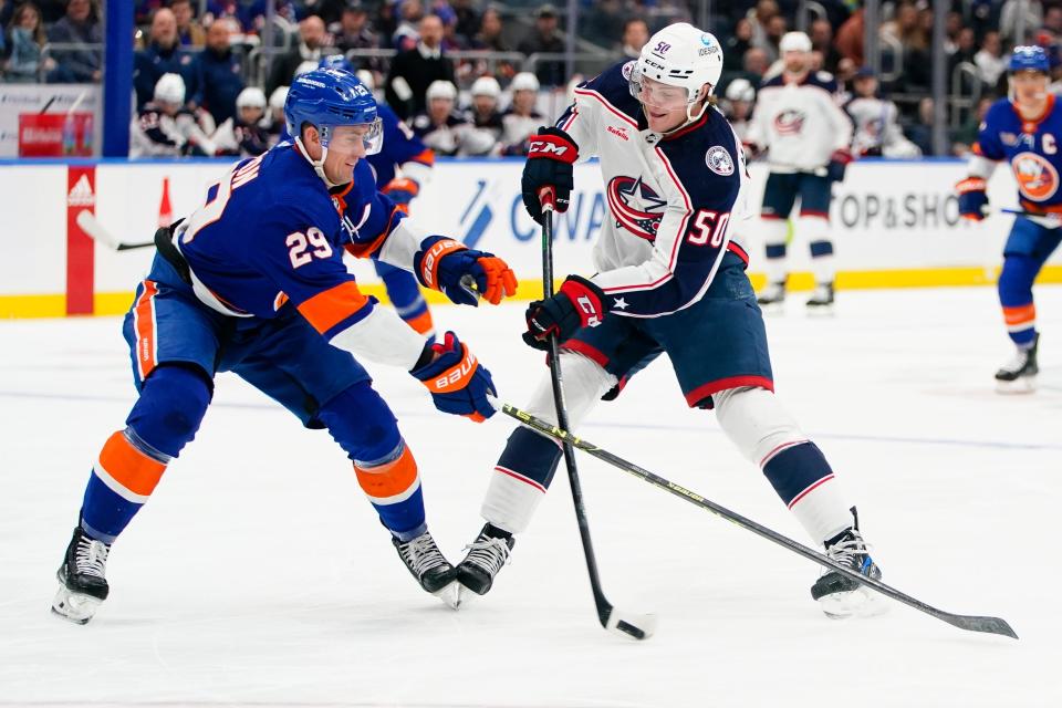 New York Islanders' Brock Nelson (29) defends against a shot by Columbus Blue Jackets' Eric Robinson (50) during the first period of an NHL hockey game Thursday, Dec. 29, 2022, in Elmont, N.Y. (AP Photo/Frank Franklin II)