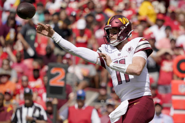 Washington Commanders quarterback Carson Wentz (11) in action during the  first half of a preseason NFL football game against the Carolina Panthers,  Saturday, Aug. 13, 2022, in Landover, Md. (AP Photo/Nick Wass