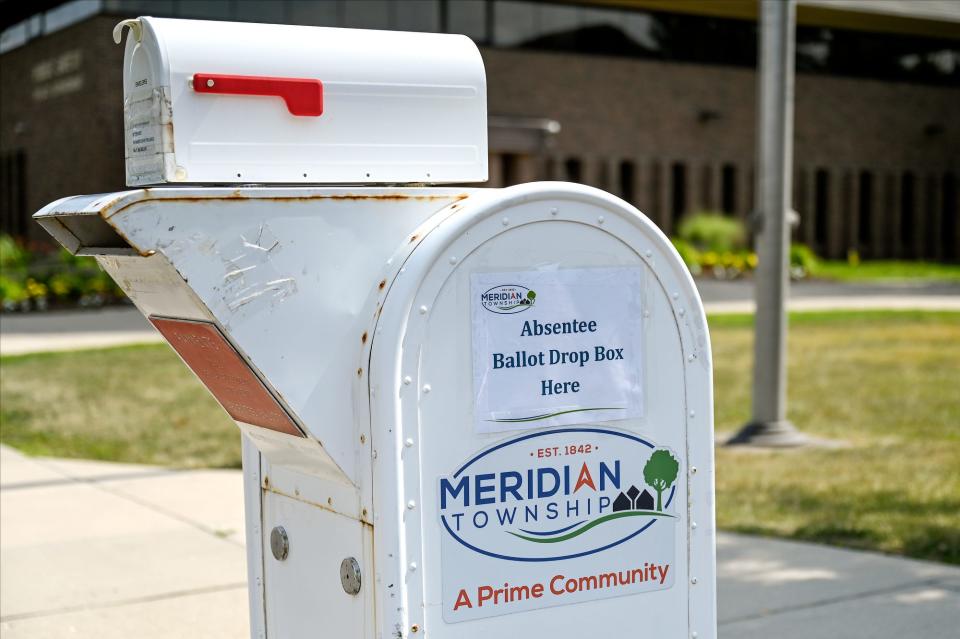 An absentee ballot drop box outside the Meridian Township Municipal Building on Wednesday, July 20, 2022, in Okemos.