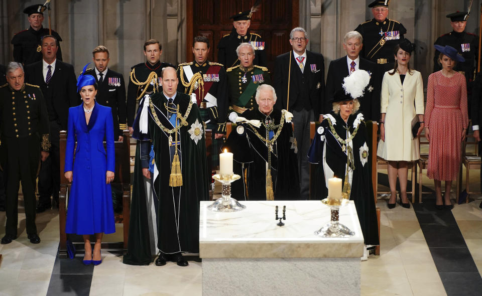 Britain's Prince William, the Prince of Wales, second left, Kate, the Princess of Wales, left, known as the Duke and Duchess of Rothesay while in Scotland, King Charles III, centre and Queen Camilla sing, during the National Service of Thanksgiving and Dedication for Britain's King Charles III and Queen Camilla, at St Giles' Cathedral, in Edinburgh, Wednesday, July 5, 2023. Two months after the lavish coronation of King Charles III at Westminster Abbey in London, Scotland is set to host its own event to mark the new monarch’s accession to the throne. (Aaron Chown/Pool Photo via AP)
