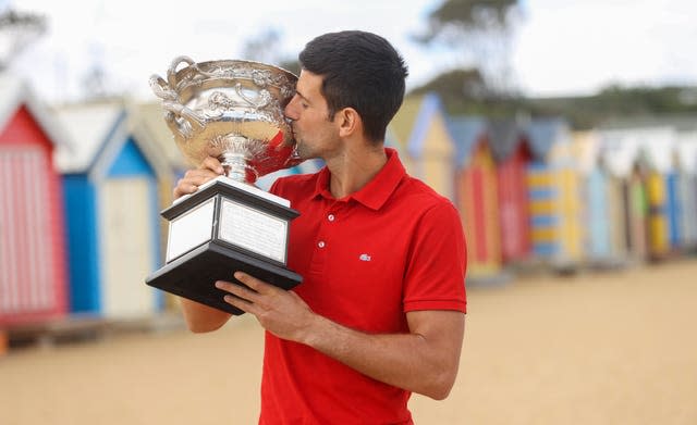 Novak Djokovic took the Australian Open trophy to the beach in Melbourne on Monday