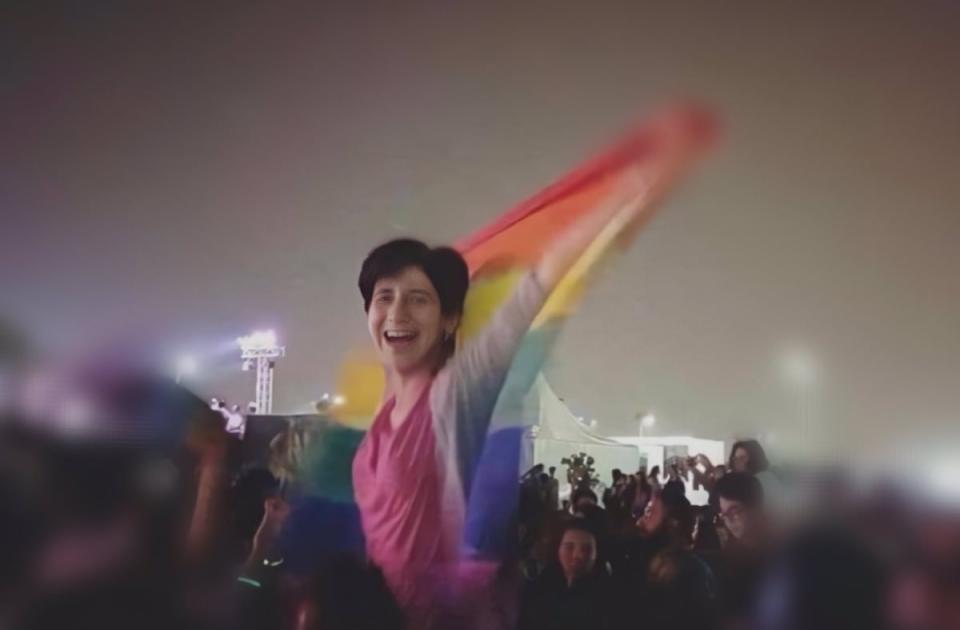 A friend captured a photo of Sarah Hegazi hoisting a rainbow flag at a concert in Cairo in 2017. She was arrested and tortured by the Egyptian authorities not long after.