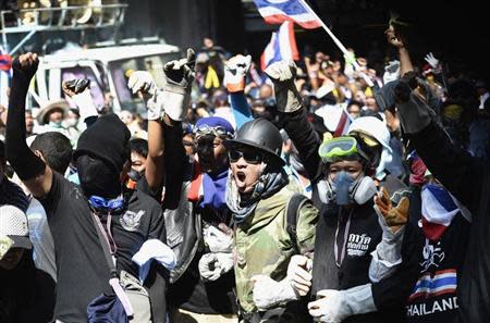 Anti-government protesters shout as they break down the barriers at the Thai Police Headquarters in Bangkok December 4, 2013. REUTERS/Dylan Martinez