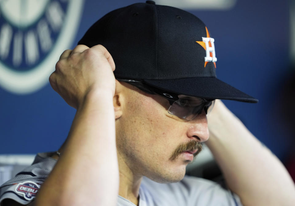 Houston Astros starting pitcher J.P. France adjusts his glasses during the fourth inning of a baseball game against the Seattle Mariners, Saturday, May 6, 2023, in Seattle. (AP Photo/Lindsey Wasson)