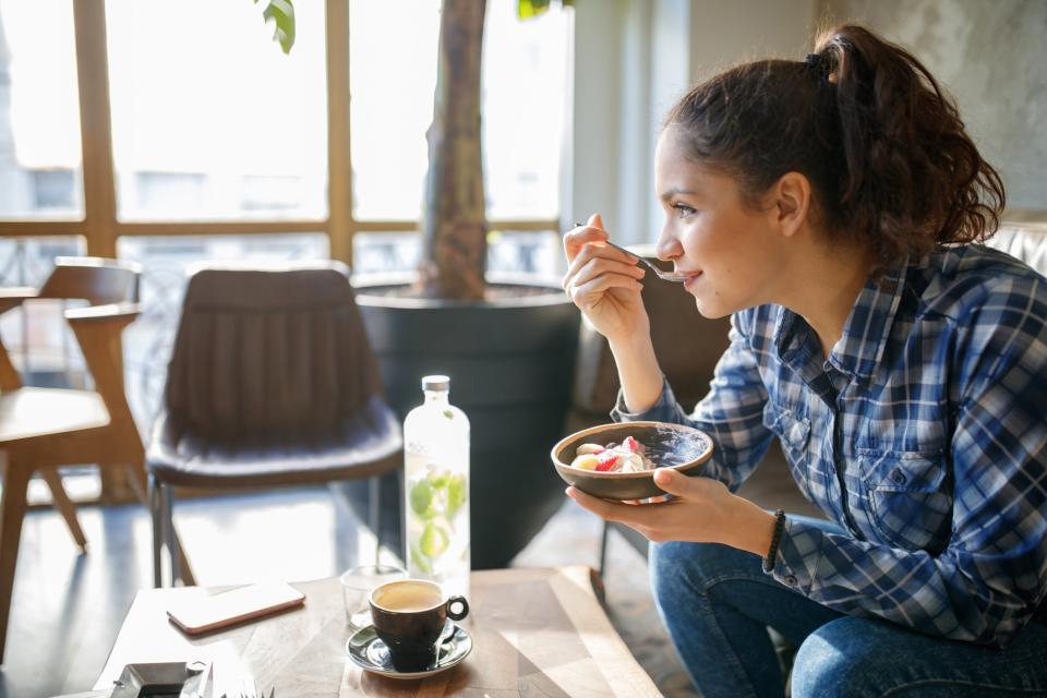 woman eating yogurt