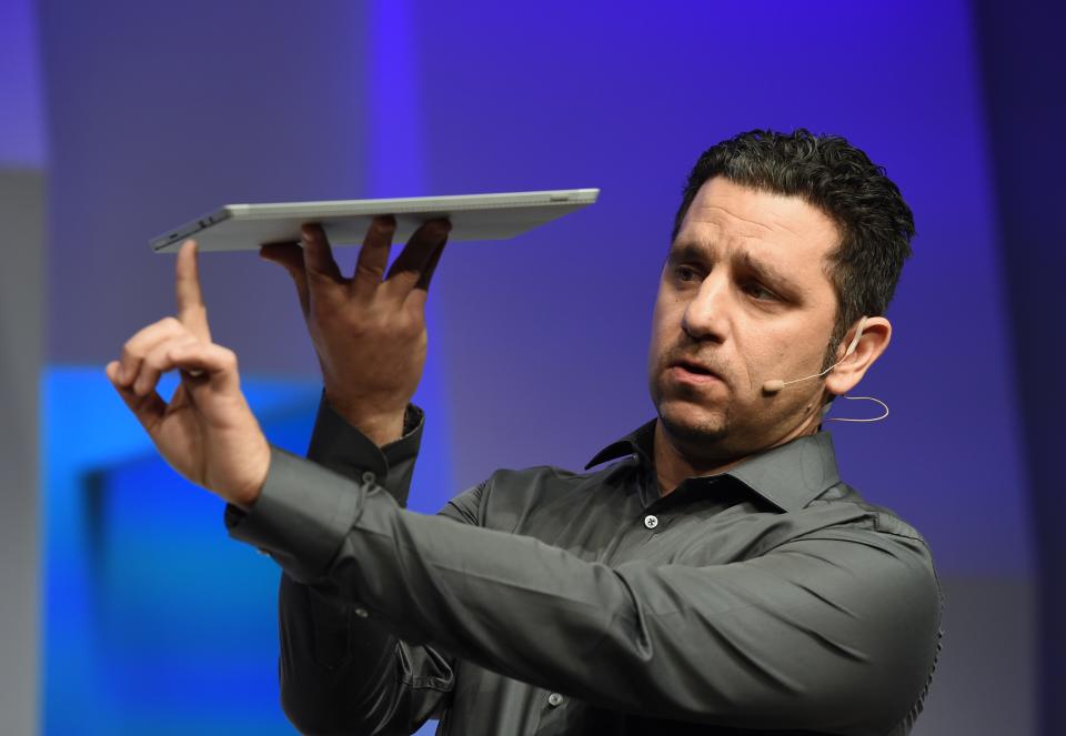 Panos Panai, corporate vice president of Microsoft's Surface division, holds the new Microsoft Surface Pro 3 tablet during a press conference on May 20, 2014 in New York.  Microsoft unveiled the Surface Pro 3 tablet at an event in New York on Tuesday, as it attempts to drum up interest in its faltering tablet line amid growing competition.  The Intel Core-powered tablet is 0.36 inches thick, features a 12-inch display, and weighs just under 2 pounds.  AFP PHOTO / Stan HONDA (Image source should read STAN HONDA / AFP via Getty Images)