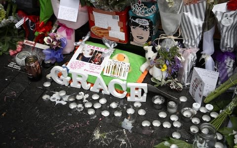 Tributes left outside the CityLife Hotel in Auckland, where Grace Millane was last seen alive - Credit: Phil Walter/Getty Images