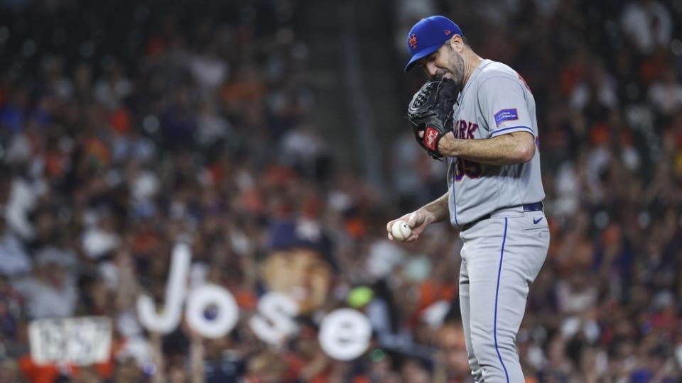 June 20, 2023;  Houston, TX, USA;  New York Mets starting pitcher Justin Verlander (35) prepares to pitch as fans hold signs for Houston Astros second baseman Jose Altuve (not pictured) during the seventh inning at Minute Maid Park.