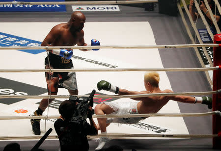 Boxing - Floyd Mayweather v Tenshin Nasukawa - Saitama Super Arena, Tokyo, Japan - December 31, 2018 Floyd Mayweather knocks down Tenshin Nasukawa in the first round REUTERS/Issei Kato