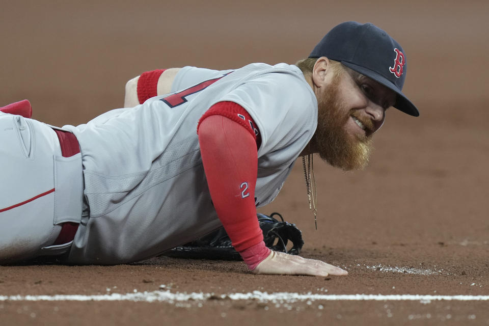 Boston Red Sox first baseman Justin Turner reacts after a throwing error by shortstop Trevor Story allowing Toronto Blue Jays' Davis Schneider to reach first during the second inning of a baseball game Friday, Sept. 15, 2023, in Toronto. (Chris Young/The Canadian Press via AP)