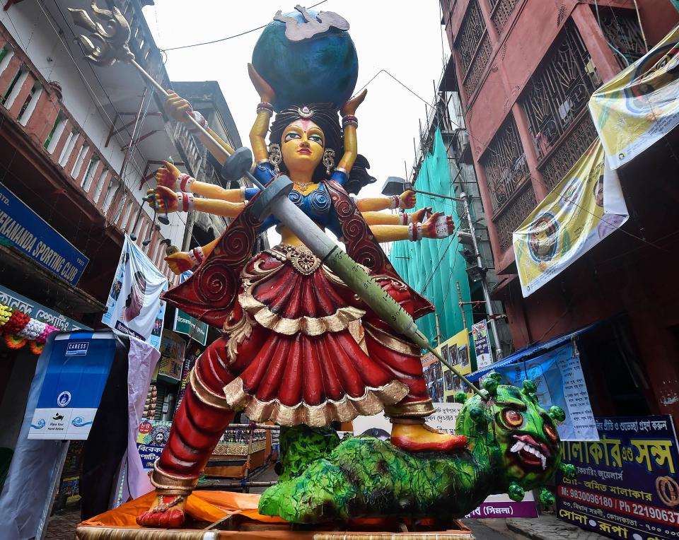 An idol of Devi Durga made from thermocol at a community puja pandal, during Durga Puja celebrations in Kolkata, Thursday, 22 October, 2020.