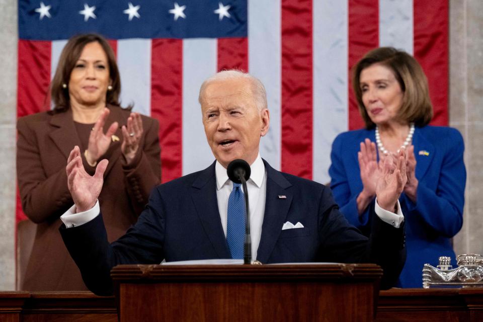 US Vice President Kamala Harris (L) and US House Speaker Nancy Pelosi (D-CA) applaud US President Joe Biden as he delivers his first State of the Union address at the US Capitol in Washington, DC, on March 1, 2022.