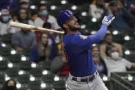 Chicago Cubs' Chicago Cubs' Kris Bryant hits an RBI sacrifice fly during the fourth inning of a baseball game against the Milwaukee Brewers Tuesday, April 13, 2021, in Milwaukee. (AP Photo/Morry Gash)