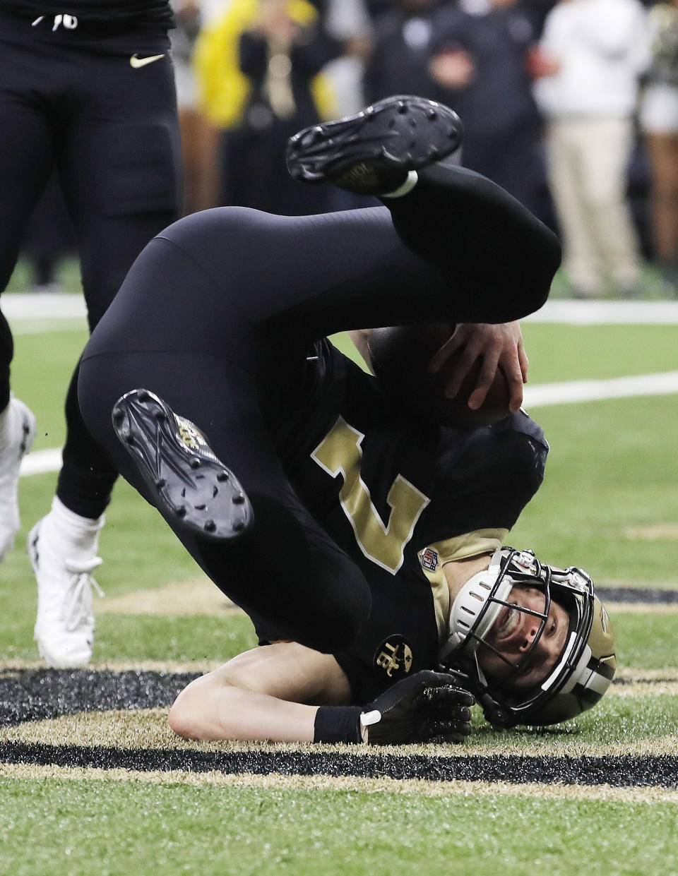New Orleans Saints' Taysom Hill catches a touchdown pass during the second half the NFL football NFC championship game against the Los Angeles Rams Sunday, Jan. 20, 2019, in New Orleans. (AP Photo/Carolyn Kaster)