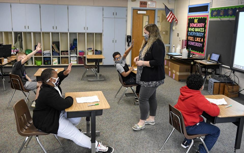 <span class="caption">Learning support teachers such as Sabrina Werley in Pennsylvania are common, but schools’ services can vary widely.</span> <span class="attribution"><a class="link " href="https://www.gettyimages.com/detail/news-photo/sabrina-werley-works-with-her-4th-grade-students-in-a-math-news-photo/1312861050" rel="nofollow noopener" target="_blank" data-ylk="slk:Ben Hasty/MediaNews Group/Reading Eagle via Getty Images;elm:context_link;itc:0;sec:content-canvas">Ben Hasty/MediaNews Group/Reading Eagle via Getty Images</a></span>