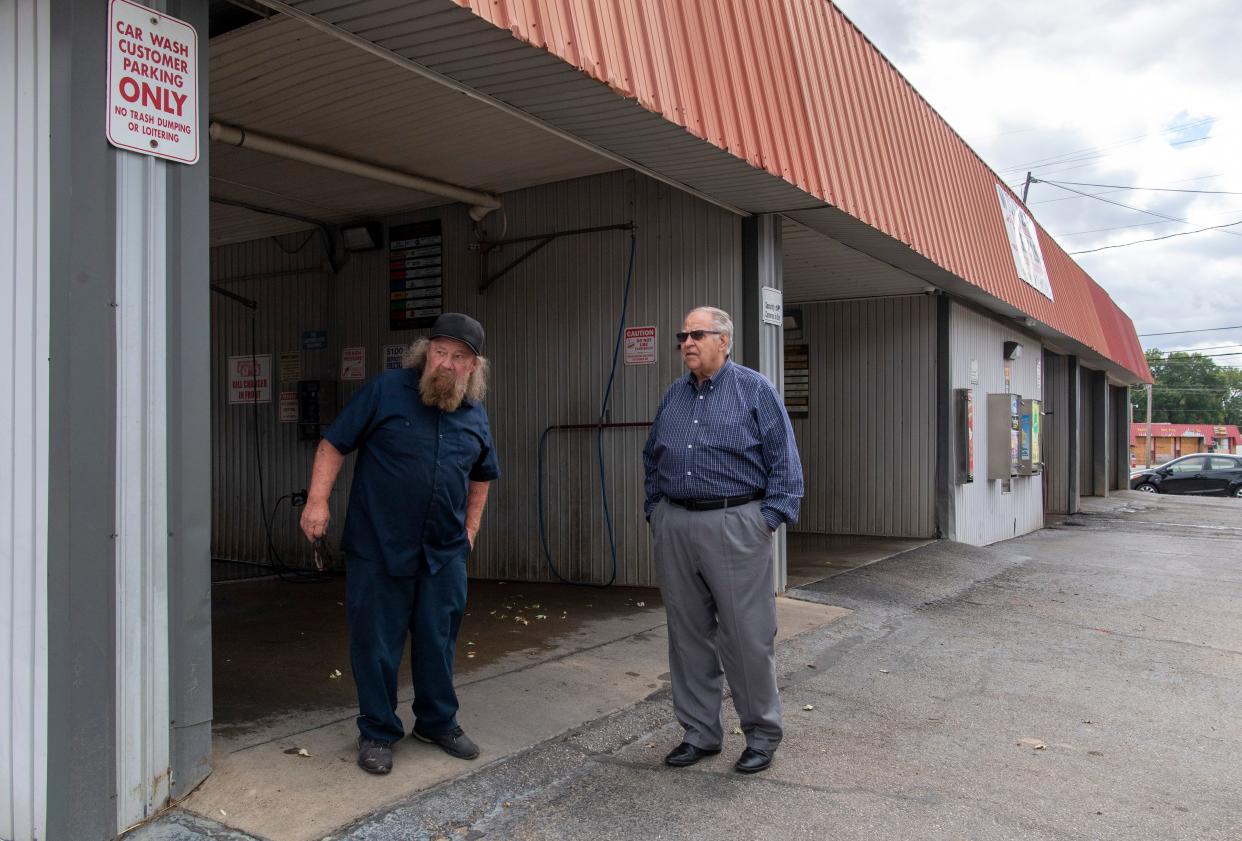 Weinbach Car Wash manager James Stinson, left, mimics the movements of fugitive Casey White while giving a tour to retired sheriff of Lauderdale County, Alabama Rick Singleton in Evansville, Ind., Friday, Oct. 13, 2023. Stinson discovered an Ford F-150 truck with a Tennessee license plate abandoned in a wash bay by Casey White May 4, 2022. Singleton was the designated spokesman to national and international media when Vicky White, assistant director at the Lauderdale County Detention Center, walked inmate and accused murderer Casey White out of jail on April 29, 2022.