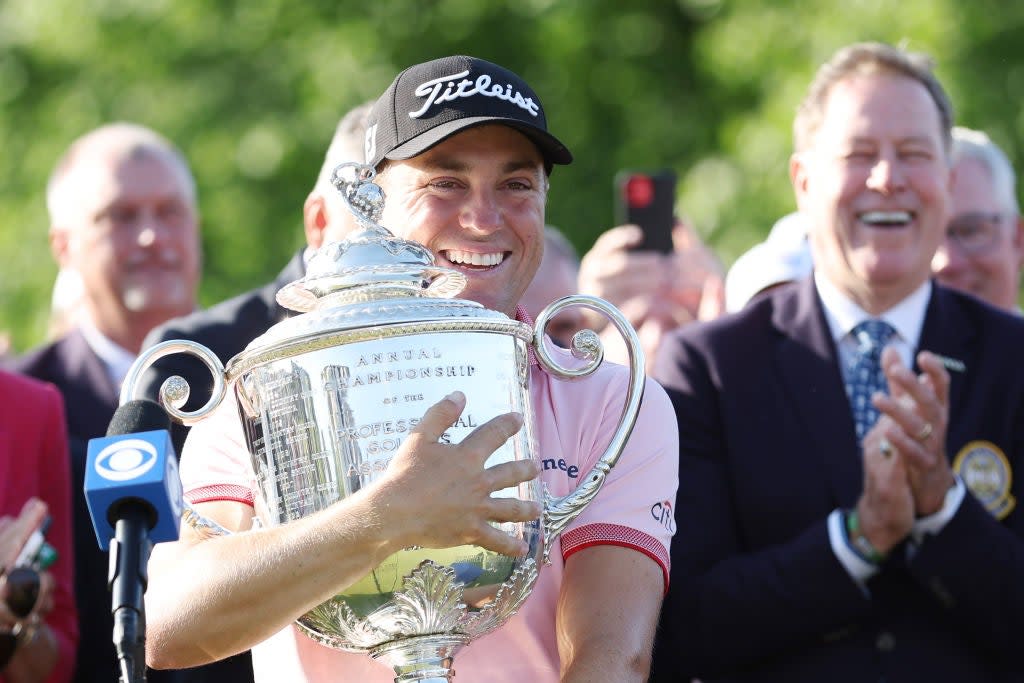 Justin Thomas clutches the Wannamaker Trophy after his play-off win  (Getty)