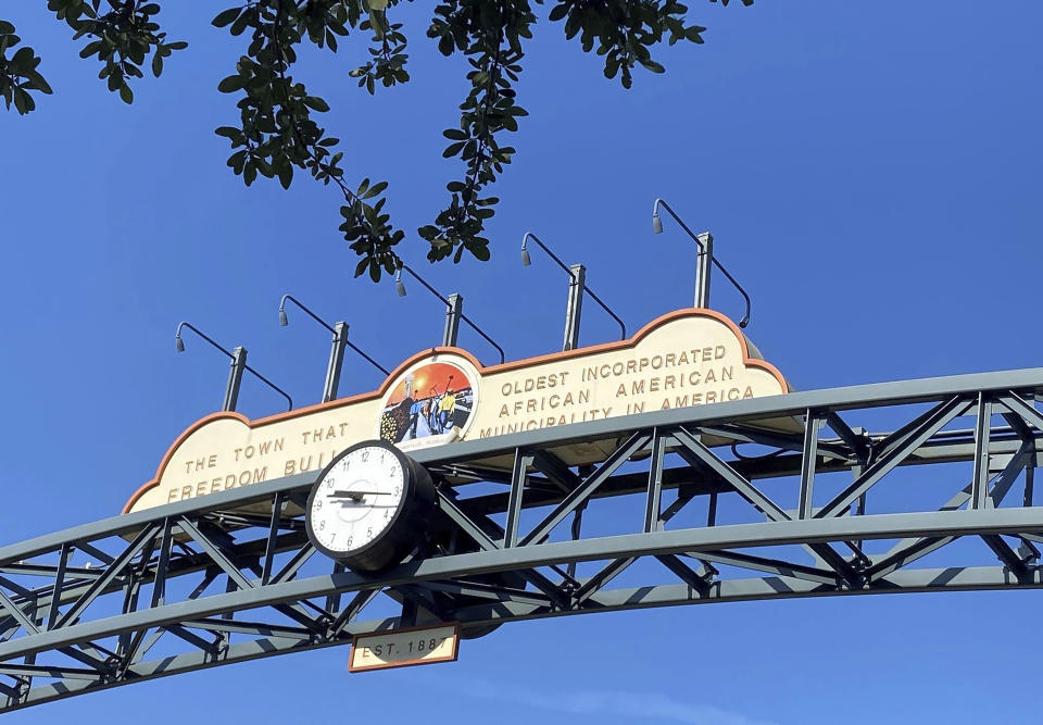 This undated photo shows the Eatonville sign in Eatonville, Fla. One of the first historically Black towns in the U.S. is suing the local school board to stop the sale of land that is tied up with Florida’s legacy of racial segregation and the state's fast-paced growth nowadays. An association dedicated to the preservation of the town of Eatonville’s cultural history on Friday sued the Orange County School board in Orlando, Florida. The town is perhaps best known through the writings of Harlem Renaissance author Zora Neale Hurston. (Joy Wallace Dickinson/Orlando Sentinel via AP)