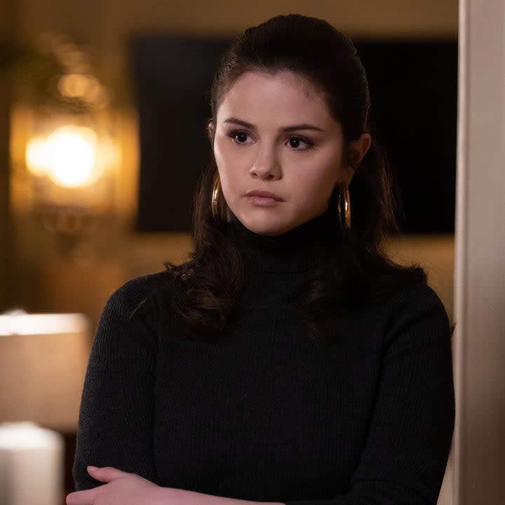 Photo of Selena Gomez as Mabel in a black turtleneck and pink lipstick