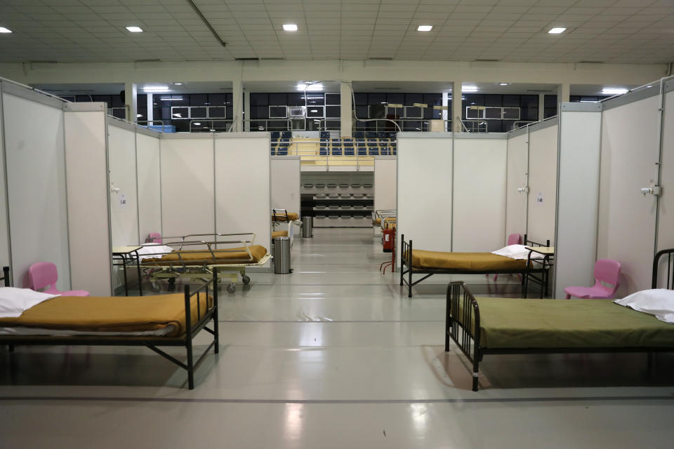 FILE - In this Jan. 20, 2021, file photo, beds are ready to receive the first patients at a field hospital set up in a sports hall in Lisbon. In its fight against COVID-19, Portugal lifted restrictions on gatherings and movements for four days over Christmas so that people could spend the festive season with family and friends. Soon after the holiday, the pandemic quickly got out of hand. (AP Photo/Armando Franca, File)