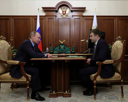 Russian President Vladimir Putin (L) meets with Deputy Finance Minister Maxim Oreshkin at the Kremlin in Moscow, Russia, November 30, 2016. Sputnik/Kremlin/Mikhail Klimentyev via REUTERS