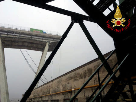 A motorway bridge which collapsed on Tuesday near the northern Italian port city of Genoa is seen in this picture released by Italian firefighters on August 14, 2018. Italian Firefighters Press Office/Handout via REUTERS