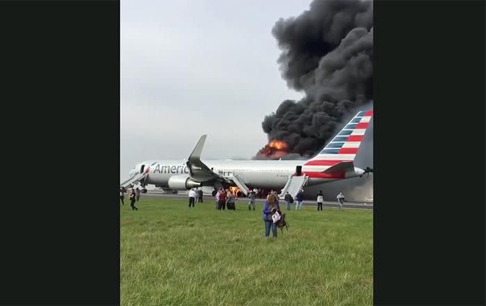 A passenger has filmed the moment an American Airlines flight burst into flames. Source: Instagram/c1arkkent