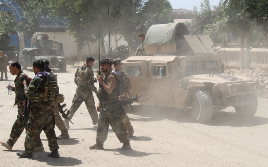 Afghan Commando forces at the site of a battlefield where they clashed with insurgents - Reuters