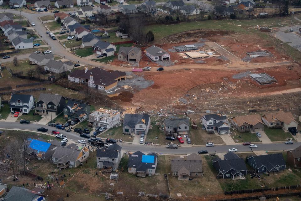 An aerial view of a Clarksville, Tenn., neighborhood from a Blackhawk helicopter on Sunday, Dec. 10, 2023 after a series of tornadoes swept through Tennessee the day prior, leaving thousands of homes damaged and at least 6 people killed.