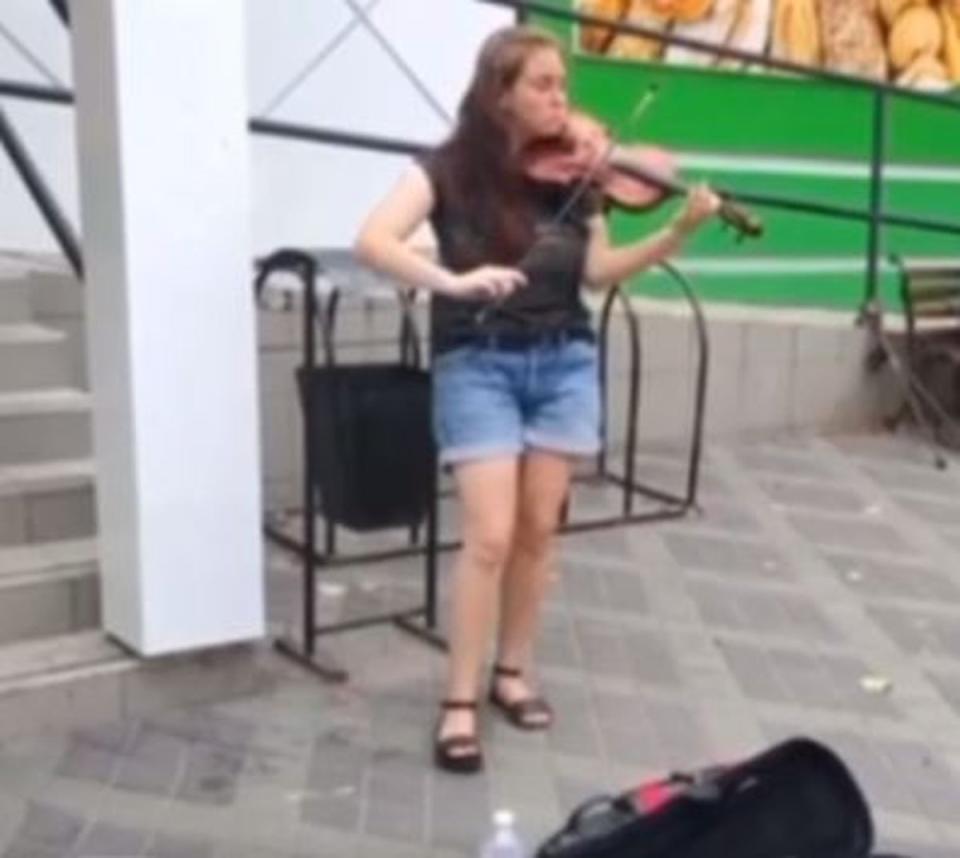 Kateryna, 25, was known for playing her violin in the centre of Slovyansk (via Telegram/supplied)