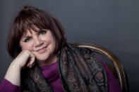 FILE - In this Sept. 17, 2013 file photo, American musician Linda Ronstadt poses in New York. Iconic actress Sally Field and foundational children’s show Sesame Street top this year’s class of Kennedy Center Honors recipients. Other chosen to receive the award for lifetime achievement in the arts include singer Linda Ronstadt, conductor Michael Tilson Thomas and the R&B group Earth, Wind and Fire.(Photo by Amy Sussman/Invision/AP, File)