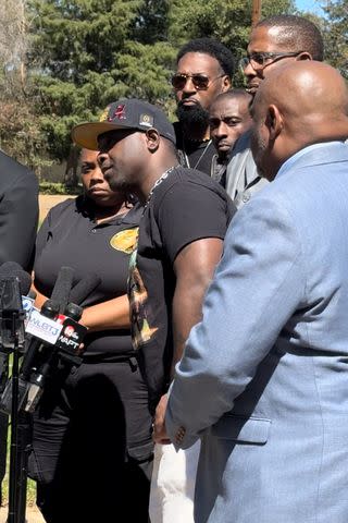 <p>Gwendolyn Eason Palmer</p> Eddie Parker, flanked by lawyers Trent Walker (in blue) and Malik Shabazz (behind him) speaks at a March 18 press conference in Jackson, Miss. Michael Jenkins, the other man tortured in Jan. 2023 is pictured standing in the back row, looking directly into the camera.