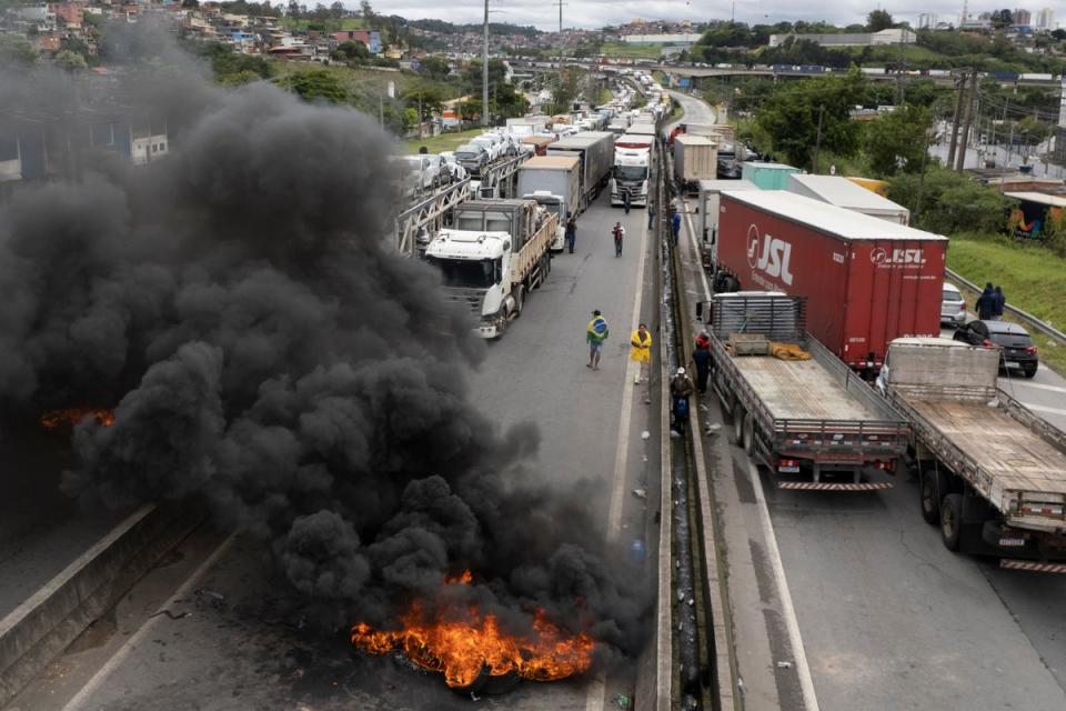 Pro-Bolsonaro truckers block a highway near Sao Paulo, Brazil on Tuesday (AP)