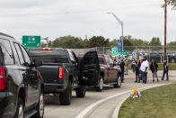 Protesting union members prevent cars from driving into the General Motors Flint Assembly Plant on Bristol Road as United Automobile Workers remain on strike against GM on Tuesday, Sept. 17, 2019, in Flint, Mich. GM and the union are faced with weakening vehicle sales, a deteriorating global economy and an unpredictable trade war. (Sara Faraj/MLive.com/The Flint Journal via AP)